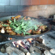 An open cooking fire upon which paella is prepared in Valencia, Spain